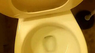 21 year old taking a piss in the toilet with a bit of penis showing