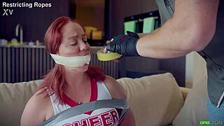 Daisy cheerleader tied and tape gagged by captor
